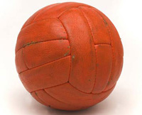 An orange football. The 1966 World Cup Final ball © National Football Museum.