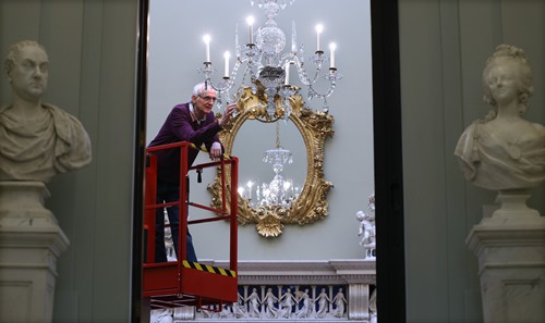 Terence installing the chandelier in the new galleries c. Gareth Jones