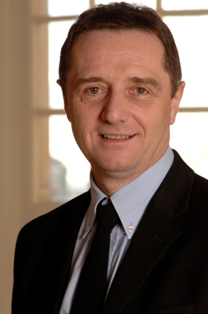 Head and shoulders shot of David Fleming in suit and tie 