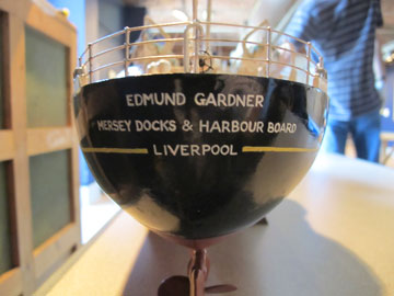 detail of ship model with the words 'Edmund Gardner, Merseys Docks and Harbour Board, Liverpool'