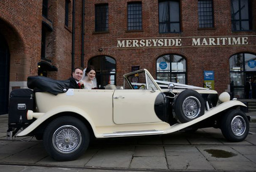 Bride and groom in a vintage car