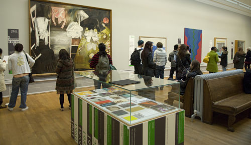 A range of John Moores Painting Prize catalogues can be seen alongside a selection of first prize winning works in room 11 at the Walker Art Gallery