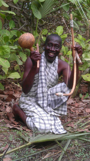 Malou Diatta with Kambalaon harp and "Leaf-Master" Gourd. Photo courtesy: Owen Burnham 2012.