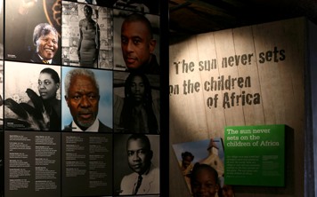 A photo of famous Black faces on a wall at the Museum
