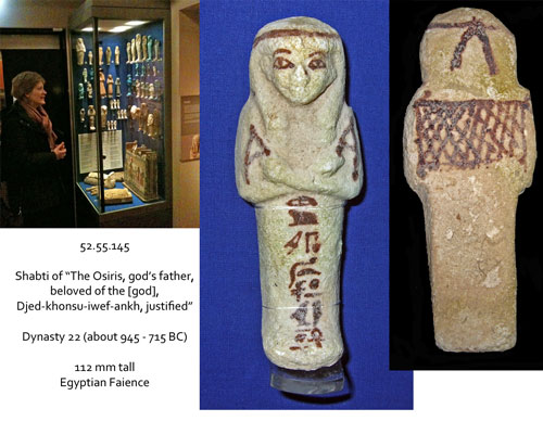 Photo of a visitor and a shabti figurine