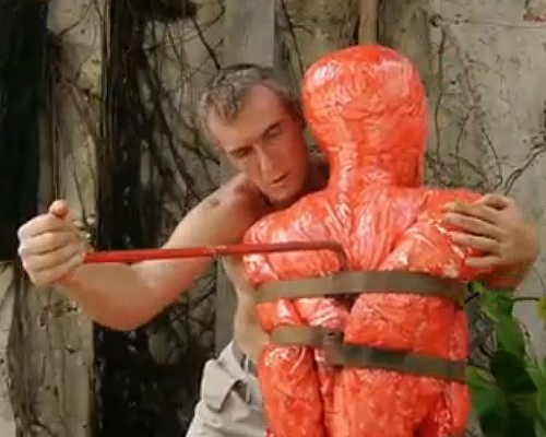 Man with red sculpture - screenshot from Timalle film 