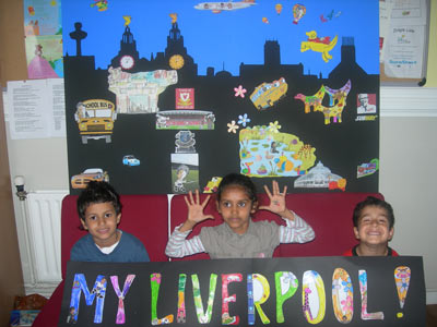 3 children in front of large collage of the Liverpool skyline
