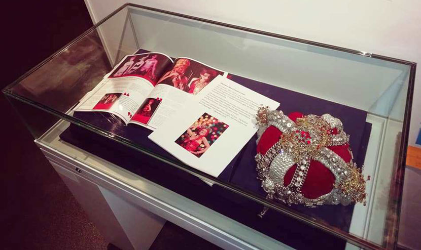 crown and photographs of the Alternative Miss Liverpool in museum display