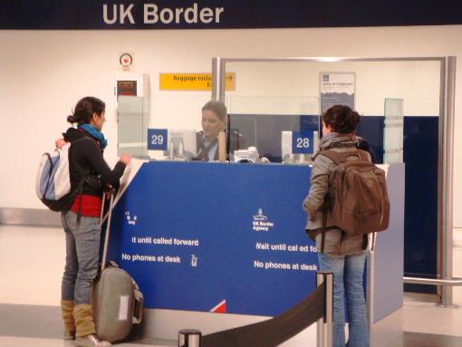 Visitors meet a Border Force Officer at passport control