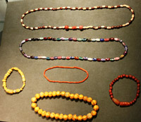 Colourful strings of beads in a display