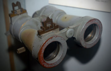 old binoculars in museum display