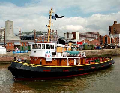 photo of a modern tug boat in a do