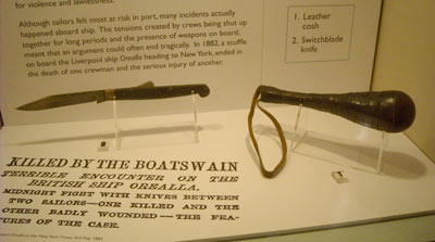 museum display with knife and leather weapon