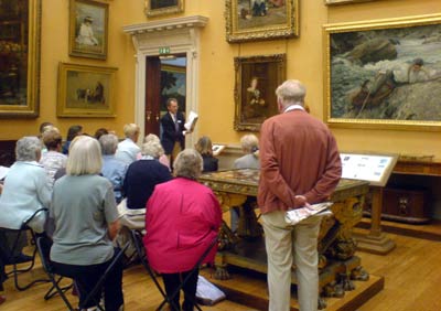 Julian Treuherz delivering  a lecture at the Lady Lever Art Gallery on 
