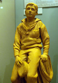 statue of a boy in naval uniform