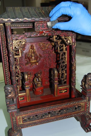 Chinese shrine being cleaned.