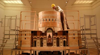conservator working on model of cathedral 