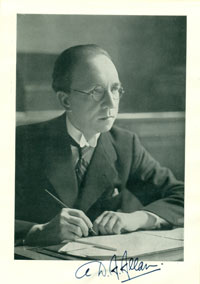 Black and white photo of Dr Douglas Allan writing