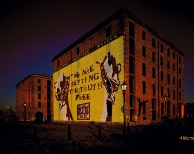 picture of outside of building with yellow projection on it