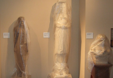 3 statues wrapped up