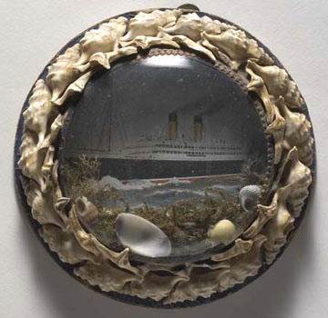 picture of the 'Empress of Ireland' liner in a glass domed frame with seashells