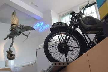 interior showing Cafe Eros and motorbike on display