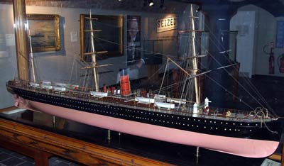 Large ship model in a display case on a gallery