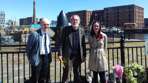 group photo by the Lusitania propeller on Liverpool's waterfront