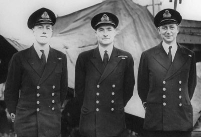 Three men in naval uniform