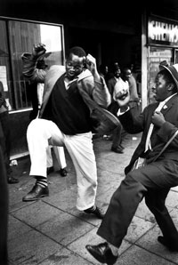 photo of men dancing in the street