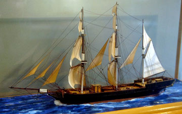 model sailing ship in a display case