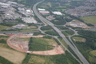 aerial photo of motorway junction with excavation site in foreground
