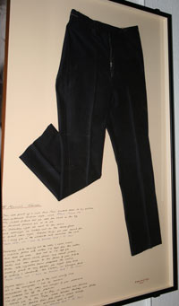 Black trousers in a frame