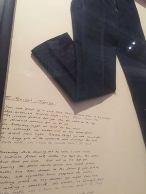 framed poem and trousers