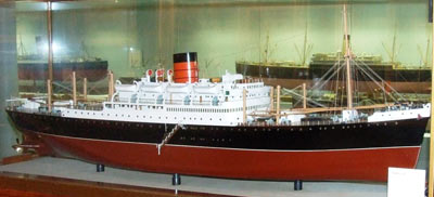 model of a large ship in a case on a gallery