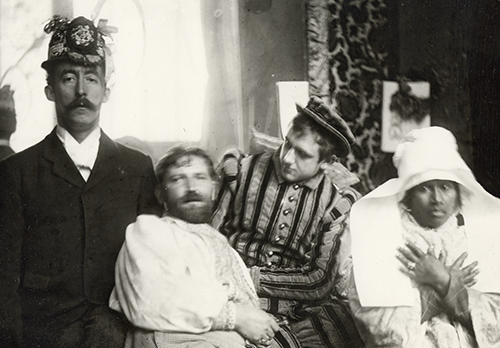 Alphonse Mucha (second from left) and friends in his studio in Paris.