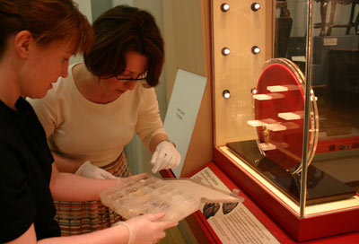 2 women installing a museum display