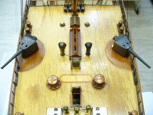 detail of guns on the deck of a ship model