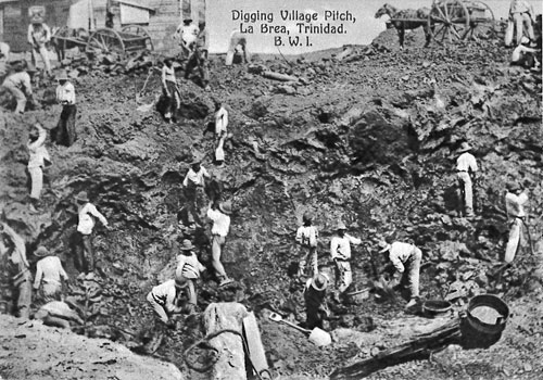old photo of people digging along a high, steep bank of the lake 