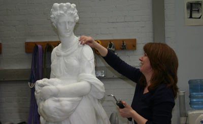 Conservator with a marble sculpture