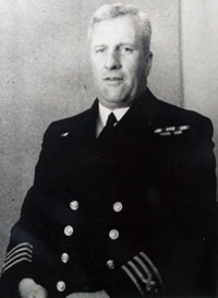 Black and white photo of a man in naval uniform