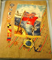 colourful, embroidered book showing flags