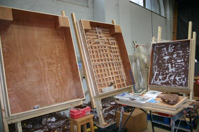 Large wooden frame on easels in studio space