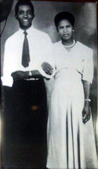 Photo of man and woman arm in arm