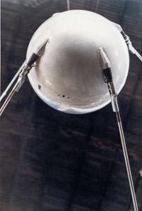 photo of a silver ball with 4 silver rods sticking out of it