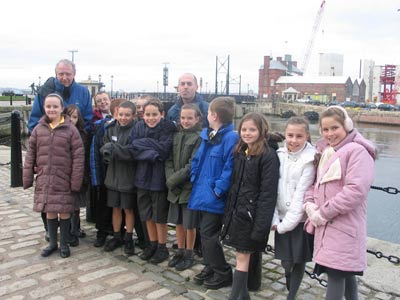 group of schoolchildren at docks