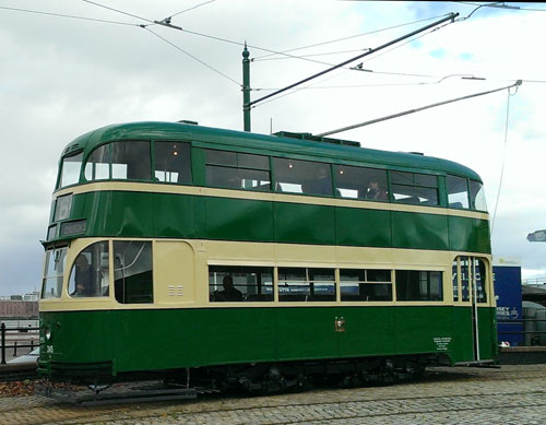 historic tram running on a tramline in Birkenhead