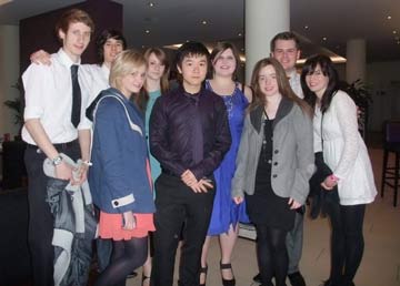 Group of nine youth volunteers at awards ceremony in London
