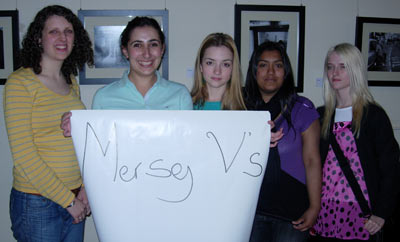 Five young women holding up a banner saying Mersey V's