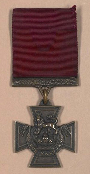 medal in the shape of a cross with a lion